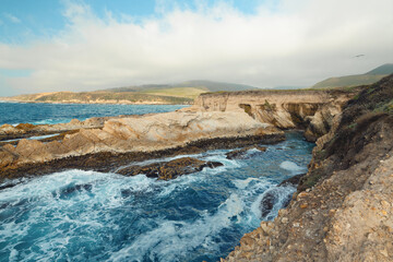 Rocky shoreline off Pacific ocean in Montana de Oro State Park, California Central Coast