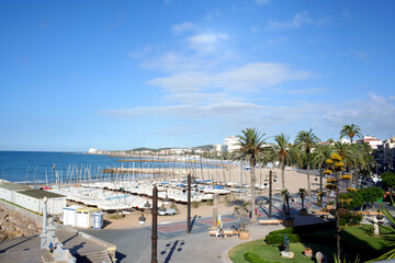 coast of Sitges with a group of boats on the beach, view from the church of Sant Bartomeu i Santa Tecla. The coastal city in Catalonia. Barcelona Spain 