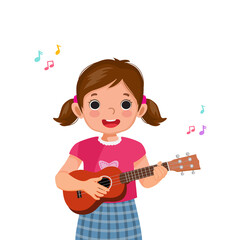 Little girl playing ukulele singing  and holding guitar with smiling facial expression