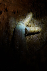 The fallen part of the stalactite that formed the shape of the clock's hands.