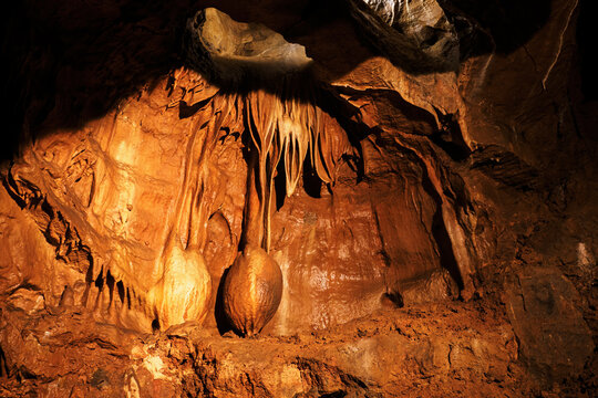 Stalactite On The Wall In The Shape Of An Onion Or A Lump.