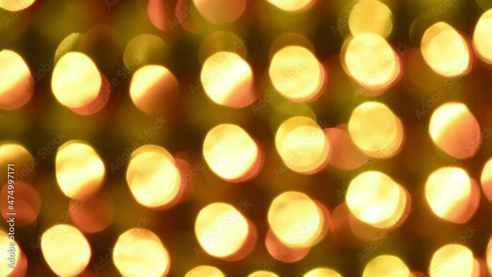 Canvas Prints fiery play of golden bokeh on a black background. round golden lights shimmer, move and fade in both