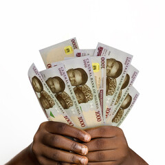 Black hands holding 3D rendered 1000 Nigerian naira notes. closeup of Hands holding Nigerian currency notes - obrazy, fototapety, plakaty