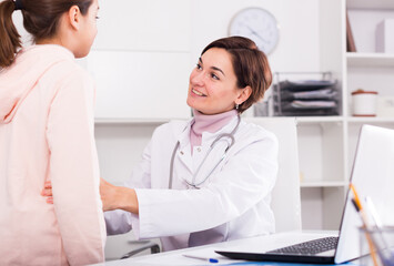 Teenage girl visits doctor in hospital for survey and check of your health