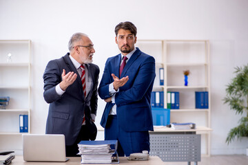 Two male colleagues working in the office