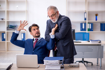 Two male colleagues working in the office