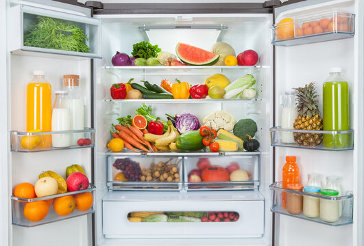 open fridge with fresh fruits and vegetables. refrigerator with healthy food.