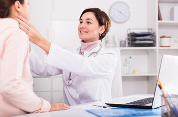 Fototapeta premium Teenage girl has come to hospital to therapist for survey of condition of health