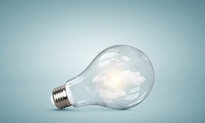 Light bulb on light blue background