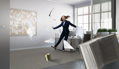 Portrait of energetic businesswoman jumping in open air