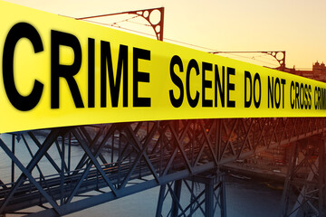 Obraz premium close-up of Yellow Tape Danger, Emergency Caution Tape, crime scene, blurry buildings in the background, police work concept, investigate crime committed in the city