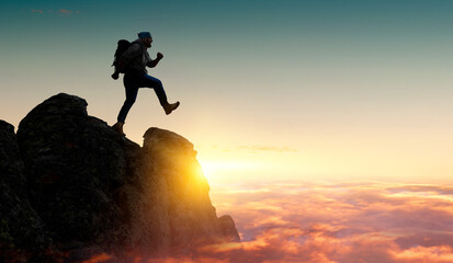 Male backpacker walking in mountains