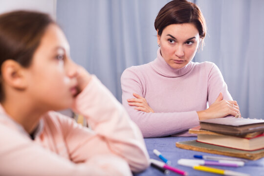 Mother seriously talks to daughter about bad progress at school