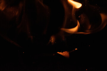 Fototapeta premium Fire flames on black background. lights on a black background.