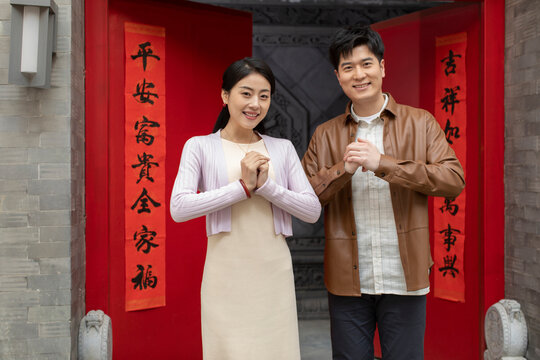 Happy young couple celebrating Chinese New Year