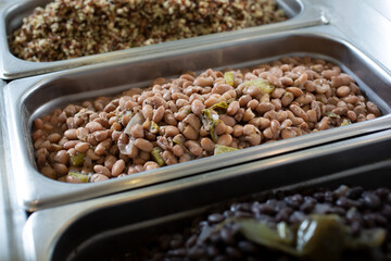 A view of a steamer pan full of prepared pinto beans.