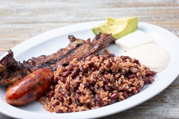 A view of a plate of carne asada and casamiento.