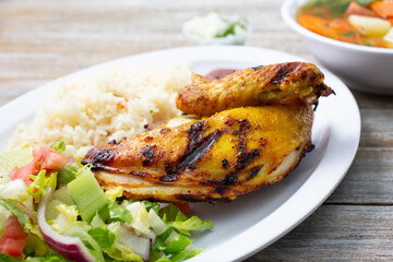 A view of a plate of pollo asado.