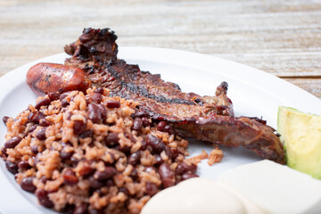 A view of a plate of carne asada and casamiento.