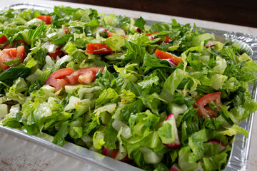 A view of a catering size container of salad.