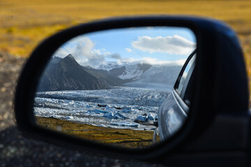 Fjallsárlón glacier and its glacial lagoon and icebergs in a rear-view mirror, Vatnajökull...