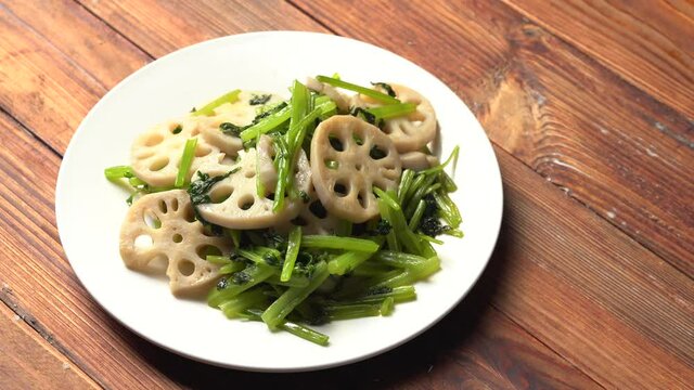 Chinese style home-cooked stir-fried celery and lotus root slices