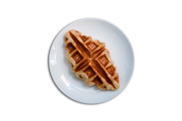 Croffle is a combination of croissant and waffle. This croffle served on a white plate 