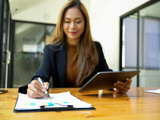 Fototapeta na wymiar Businesswoman examines financial data from her financial report