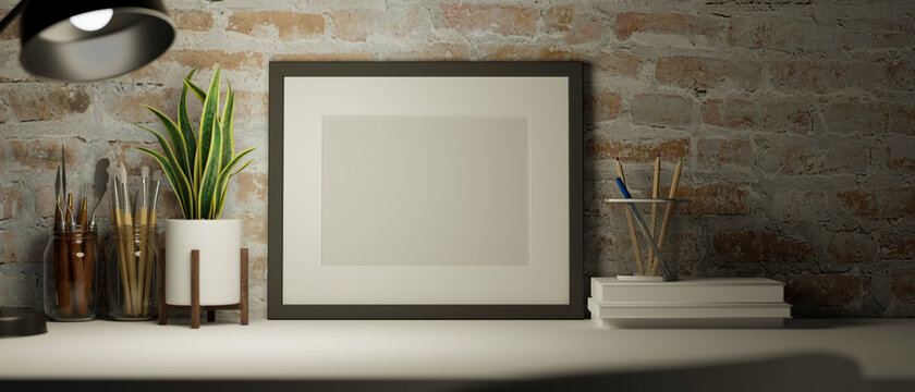 Blank picture frame mockup on a table with home decorations