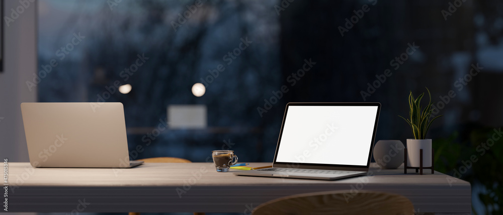 Canvas Prints modern co-working space in office at night with two laptop computer