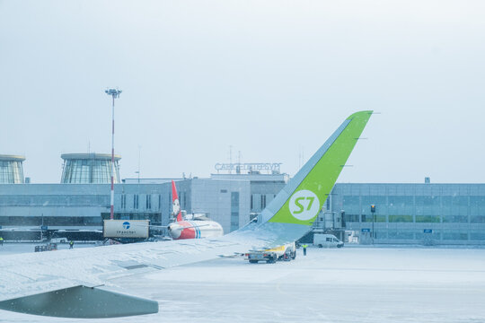 Saint-Petersburg, Russia - February 13, 2021: Airplane of Airline S7 in the airport Pulkovo in winter.