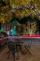 Inviting MEtal Table and Chairs Next to a Lit Up Oak Tree in the Georgetown Square
