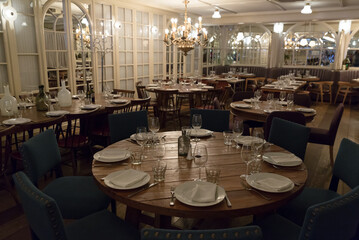 Light interior of cozy hall of modern restaurant