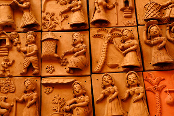 Pune , 11 December 2021: Terracotta tiled artwork at Handicraft Fair in Pune. Beautiful terracotta carving hindu Gods figure on the Tile, relief art.