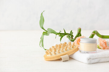 Spa set with flowers on light background