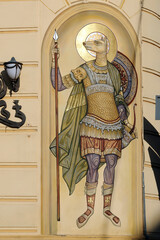 Saint Christopher with dog head on facade of a building, Lviv, Ukraine