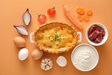 Tasty beef pot pie with ingredients on color background