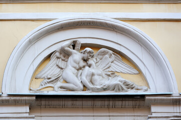Fragment of old building with relief on facade in Lviv Ukraine