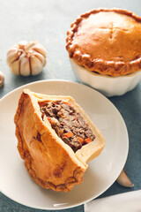 Plate with tasty beef pot pie on color background