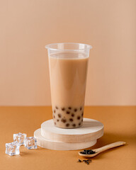 Taiwan milk bubble tea with tapioca in a plastic cup, selective focus