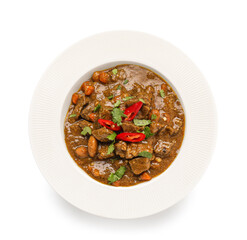 Plate with tasty beef curry on white background