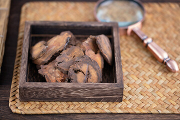 Rhubarb in a wooden box and a magnifying glass
