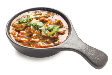 Frying pan with tasty beef curry on white background
