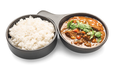 Frying pan with tasty beef curry and rice in bowl on white background