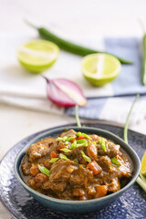 Plate with tasty beef curry on table