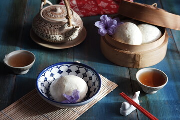 steamed bun named bao zi or bapao in a patterned plate 