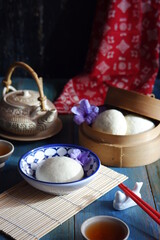 steamed bun named bao zi or bapao in a patterned plate 