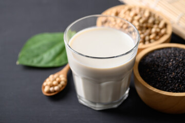 Soy milk with black sesame on black background, Healthy drink