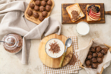Tasty desserts with flax seeds on grunge background