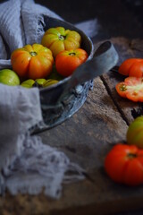 fresh tomatoes in a rustic tray